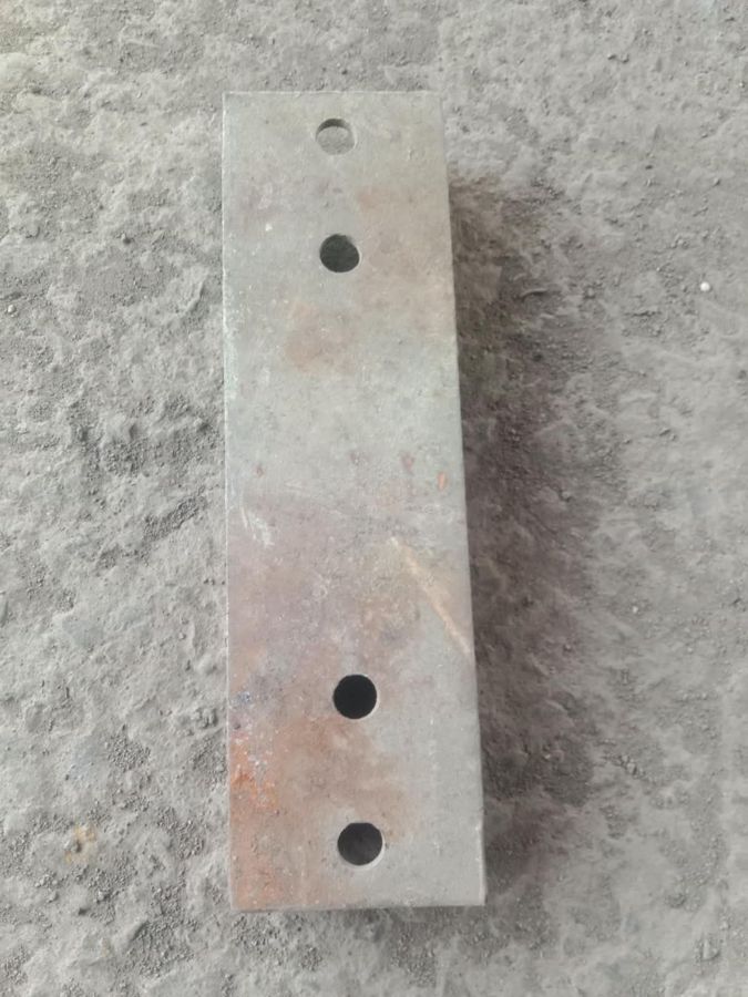 Galvanized plate with brown rust staining across its face