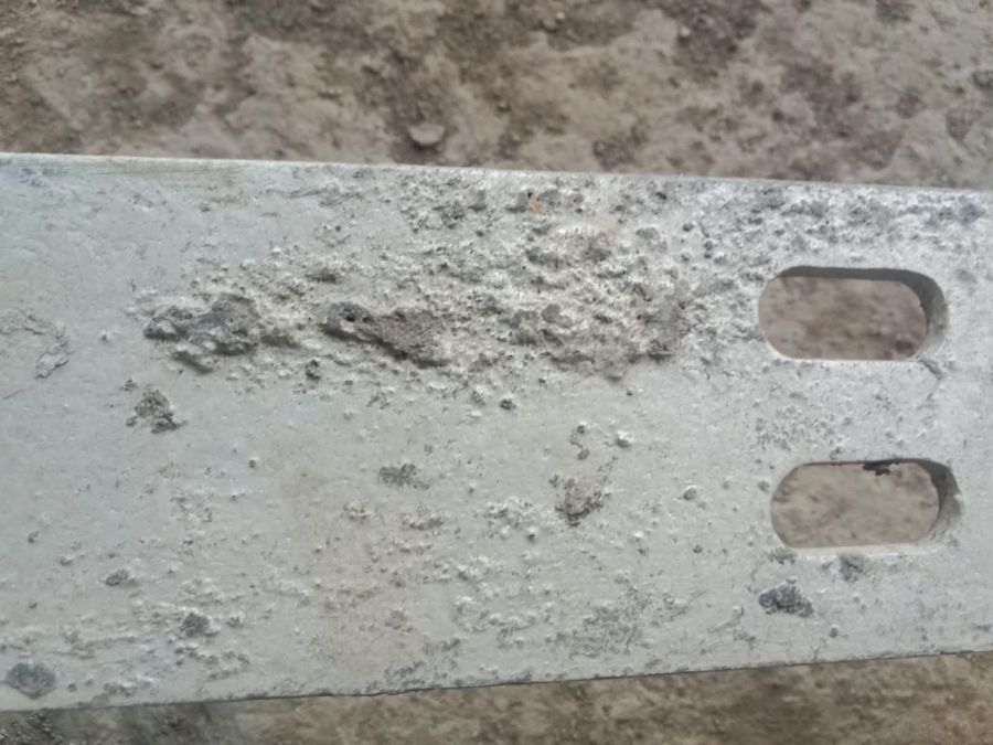Galvanized flat with raised, gritty dross pimples on its face