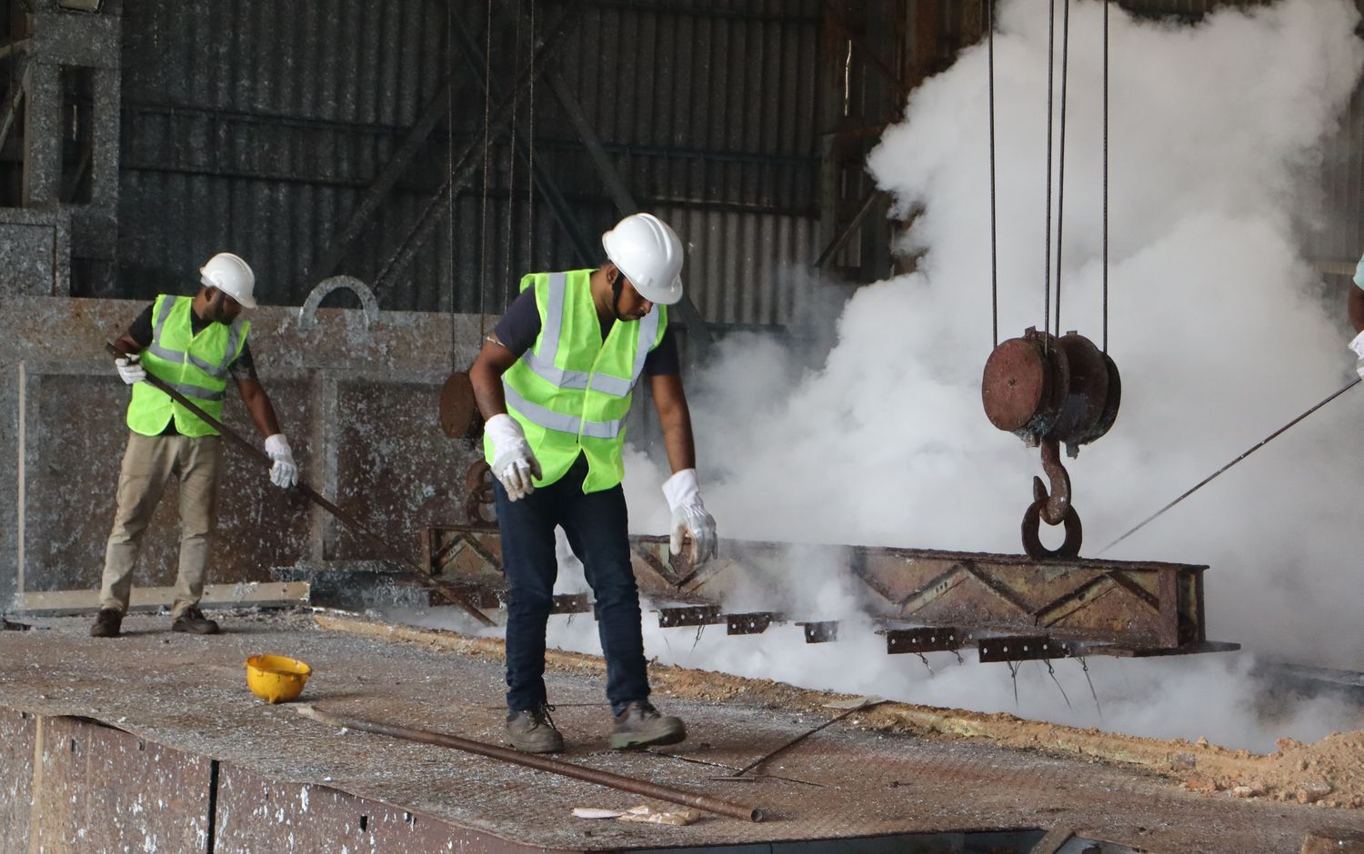 Operators at the zinc kettle at the Indo East works, Jangalpur, Howrah