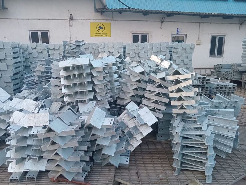 Galvanized bracket assemblies. Bracket and cleat assemblies after galvanizing, waiting to be counted and bundled against the bill of materials.
