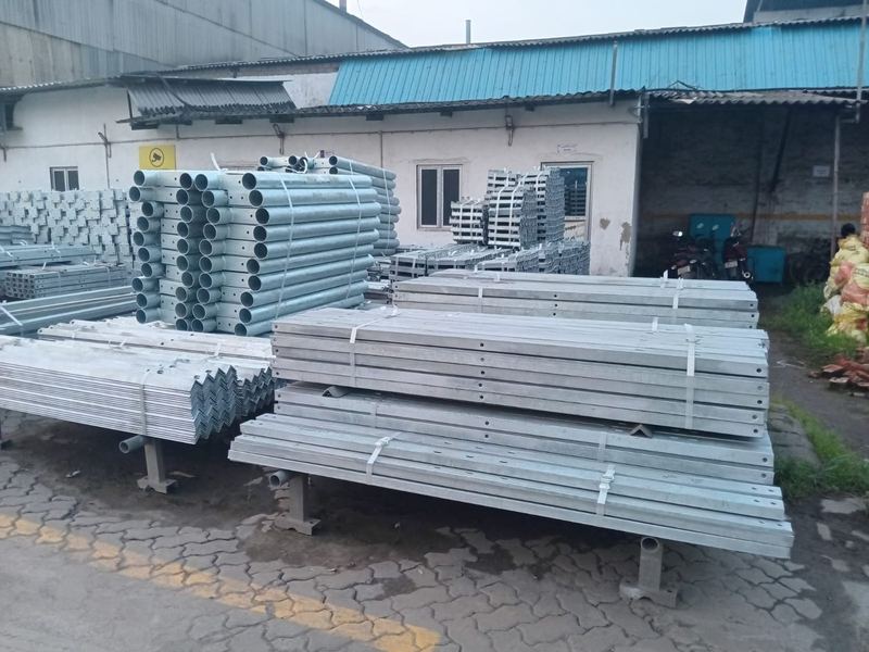 Bundled members on stands. Galvanized members and poles bundled on stands in the yard. Stock is kept off the ground so the coating is not sitting in standing water.