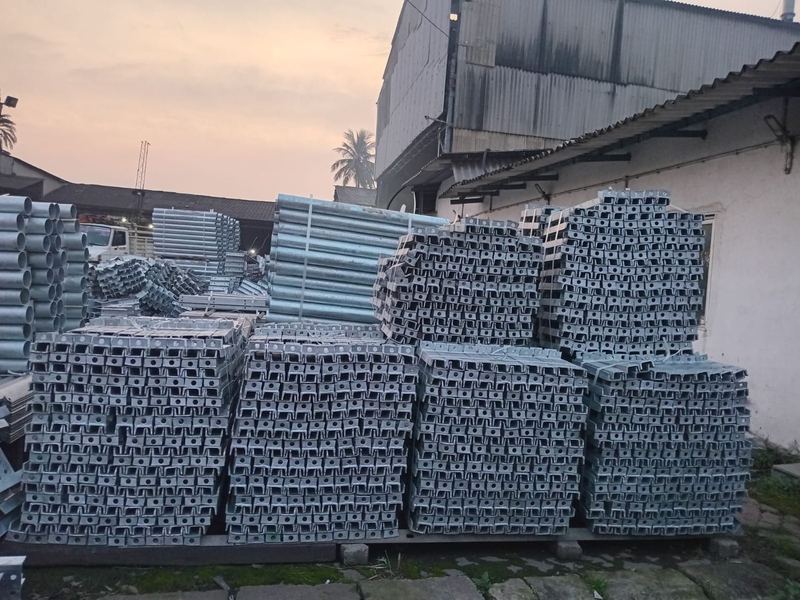Palletised channel members. Galvanized channel members stacked and palletised in the despatch yard at the end of the shift.