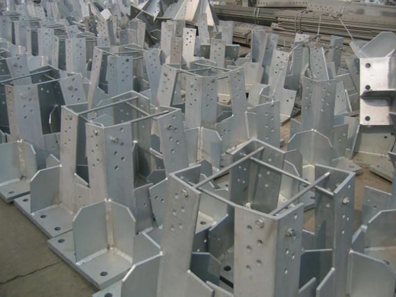 Tower base sections. Galvanized tower base and leg sections. The bolt pattern, the gusset and the coating all come off the same floor.