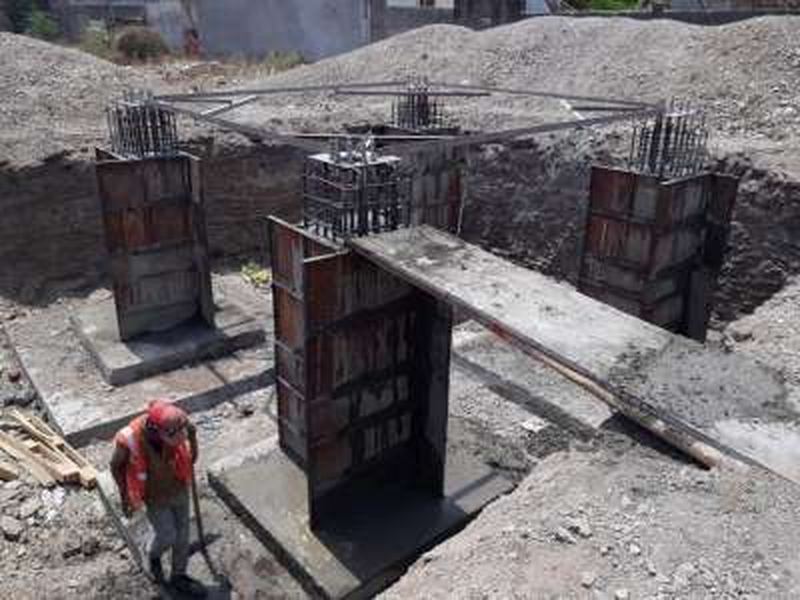 Shuttering and pedestal casting. Shuttering set for the foundation pedestals, with the stub template held to level and line before the pour.
