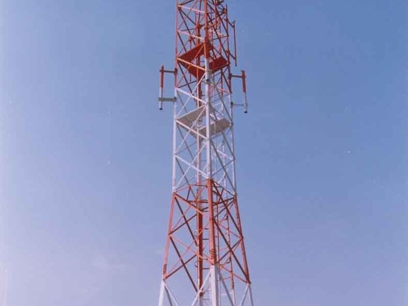 Rooftop telecom tower. A rooftop tower in service. Hamilton poles have been supplied to the Department of Telecommunications since 1987.